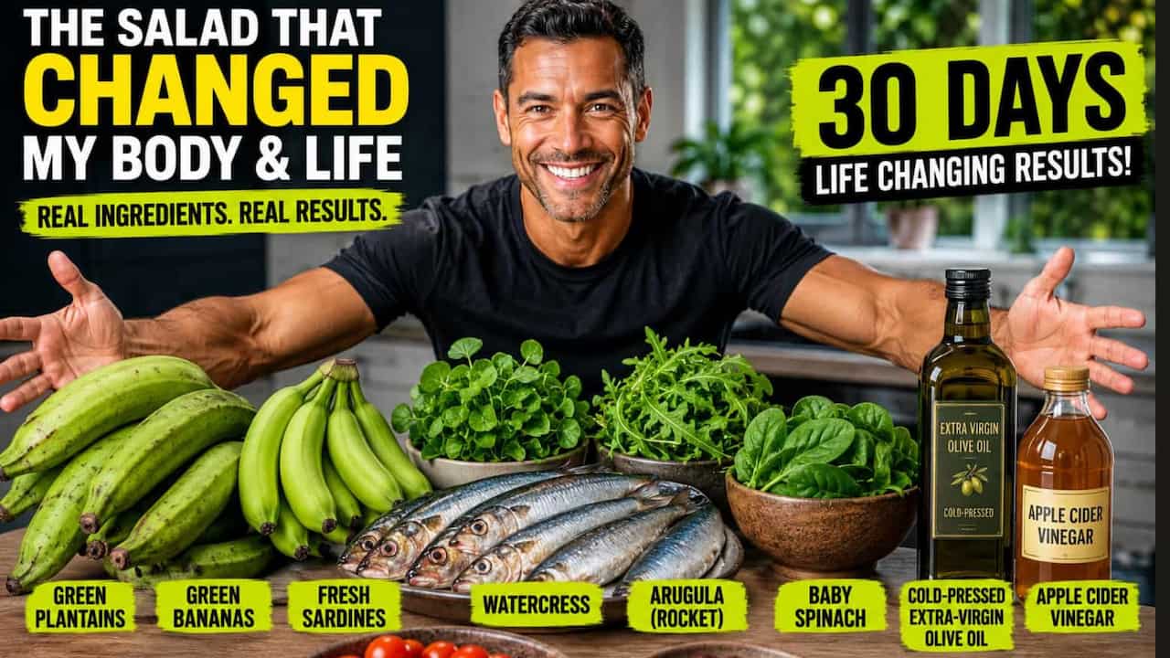 The Simple Salad That Sparked the Most Remarkable 30-Day Transformation I’ve Ever Experienced Fit, healthy mixed-race man smiling with his arms outstretched over a table filled with green plantains, green bananas, fresh sardines, watercress, arugula, baby spinach, extra-virgin olive oil, apple cider vinegar, cherry tomatoes, and pitted olives in a bright modern kitchen, showcasing the fresh ingredients used in a nutrient-dense sardine and green plantain salad.